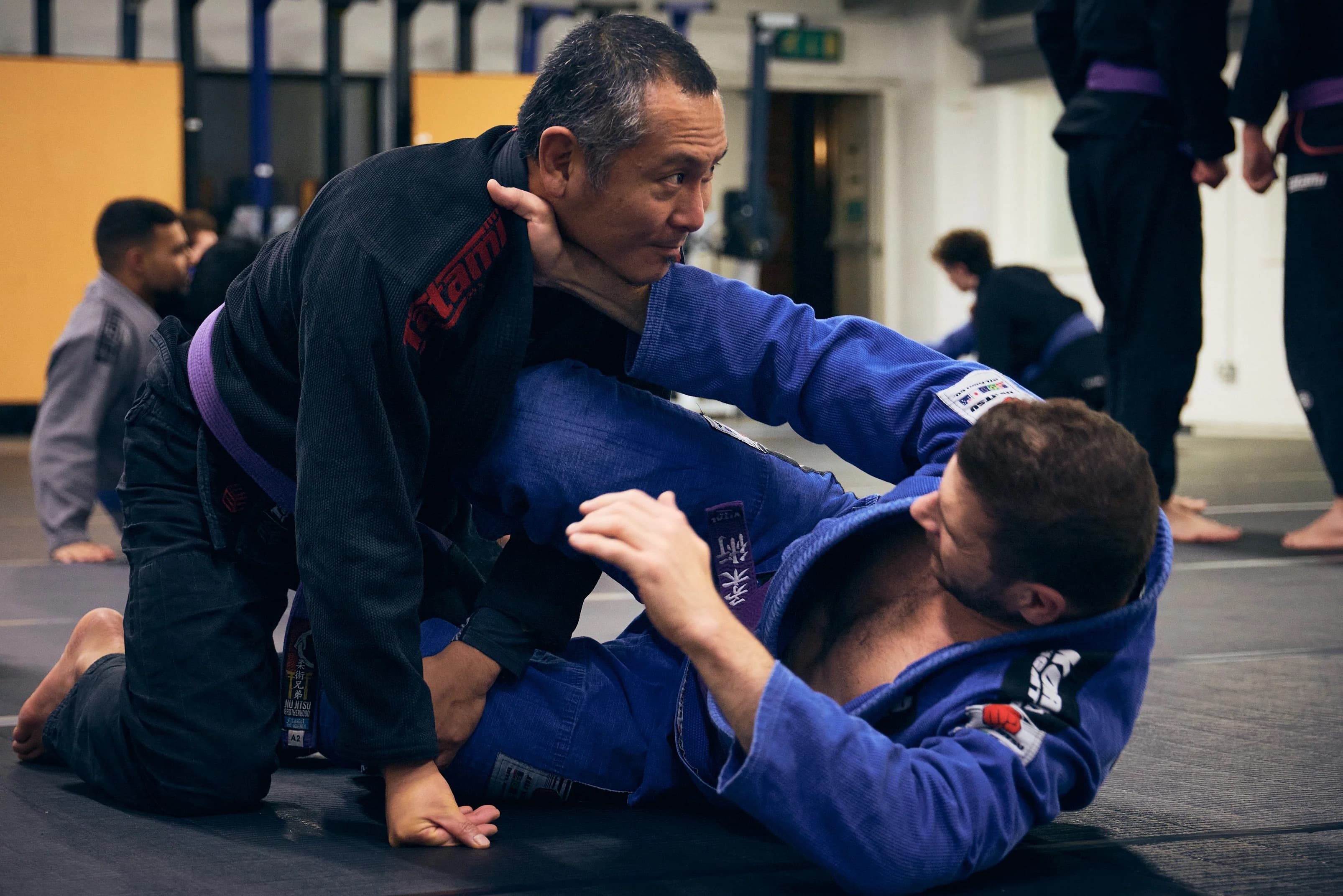 Jiu Jitsu practitioners training together on the mats